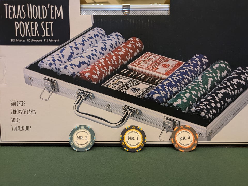 Custom season winner chips lined up on the felt